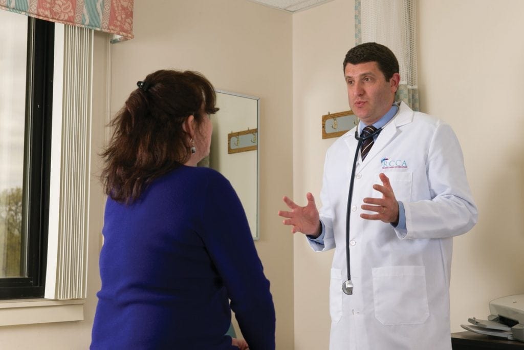 Cancer specialist talking with patient about her results