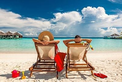 Couple Lounging At Beach