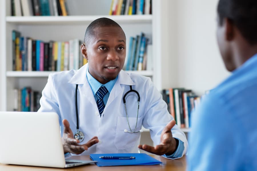 Doctor Consulting With Patient