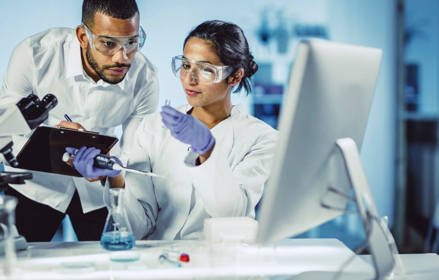 Scientists performing lab analysis
